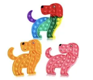 A group of three different colored dogs that are standing up.