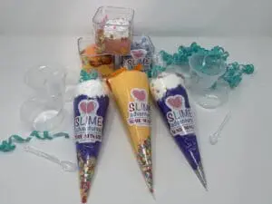 Three cones of different flavors are sitting on a table.