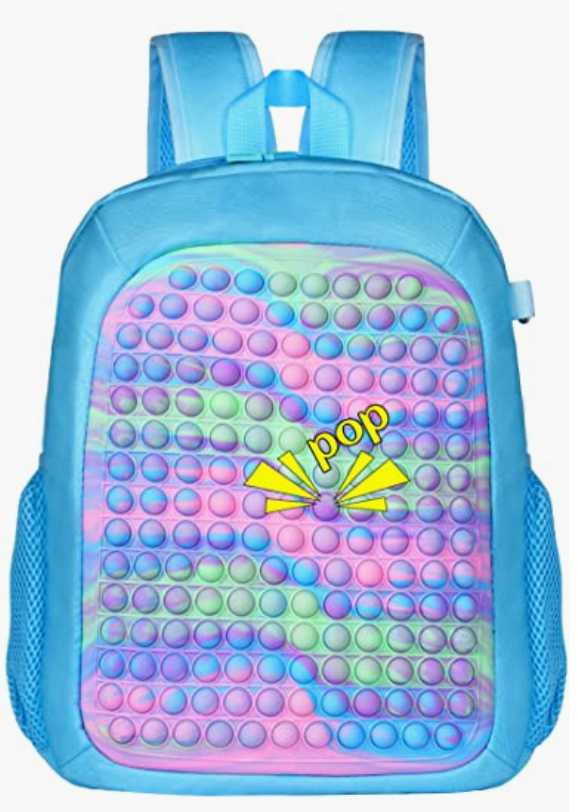 A blue backpack with colorful balls on it.