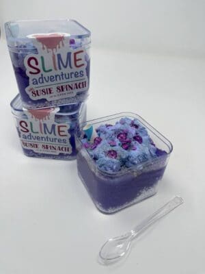 A close up of three containers of slime