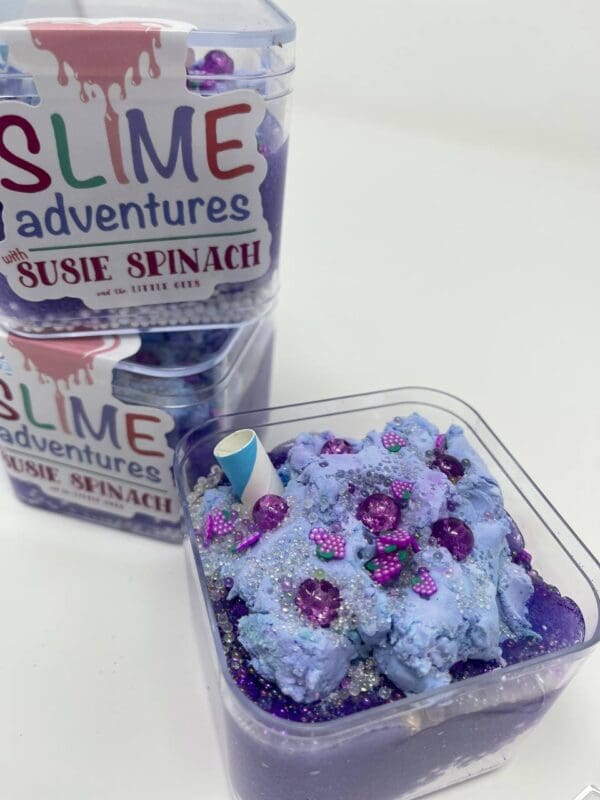 A bowl of blue and purple slime next to a tub of blue and white slime.