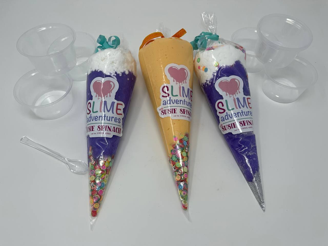 Three different types of ice cream cones with a straw in them.