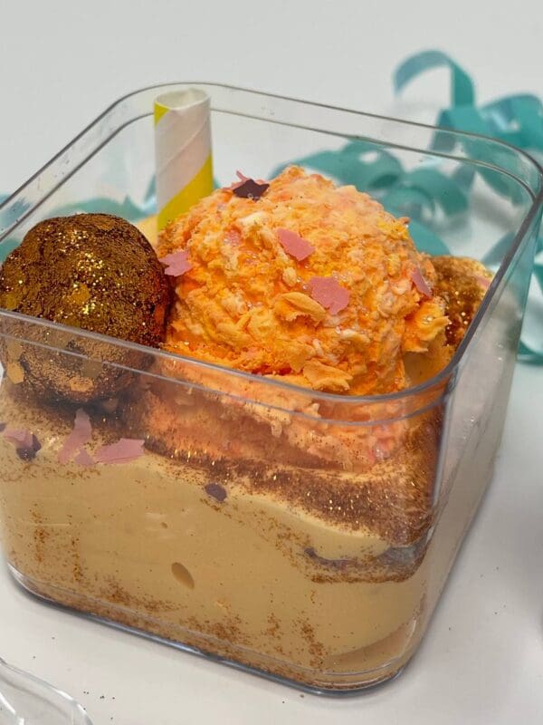 A container of food with some kind of cake